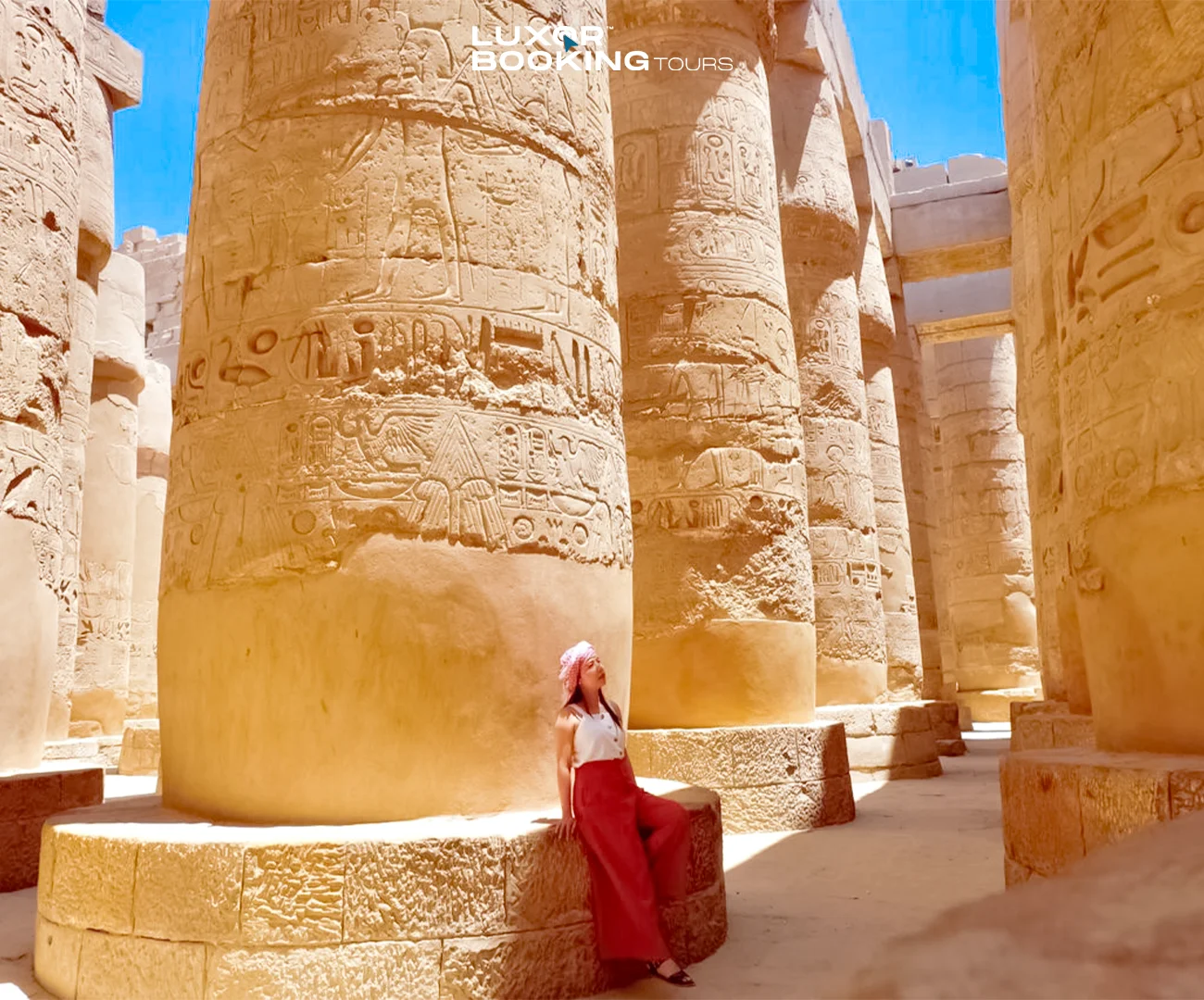 Independent traveler exploring an ancient Luxor temple quietly
