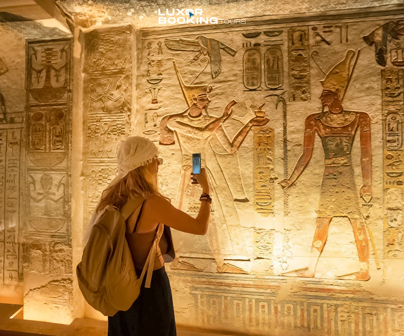 Interior view of an ancient Egyptian tomb with symbolic wall scenes