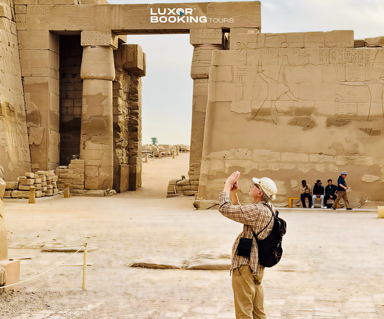 tourist reviewing luxor tour options before booking