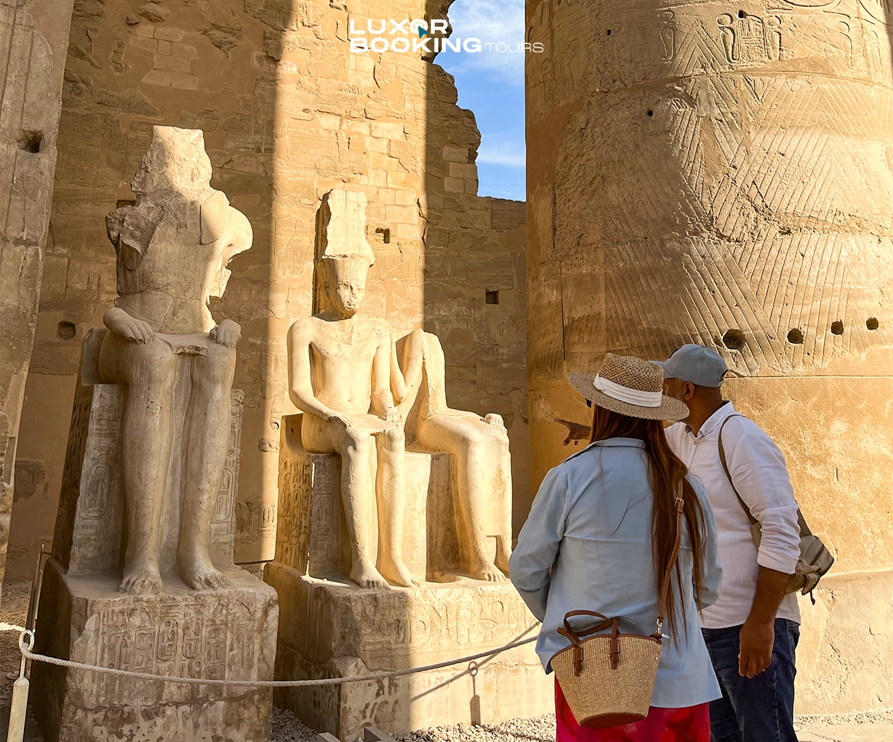 private tour guide explaining luxor temple to tourists