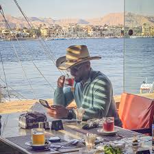 traveler sitting quietly overlooking luxor landscape in peaceful moment