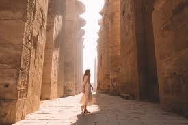 tired tourist resting at luxor temple after long day