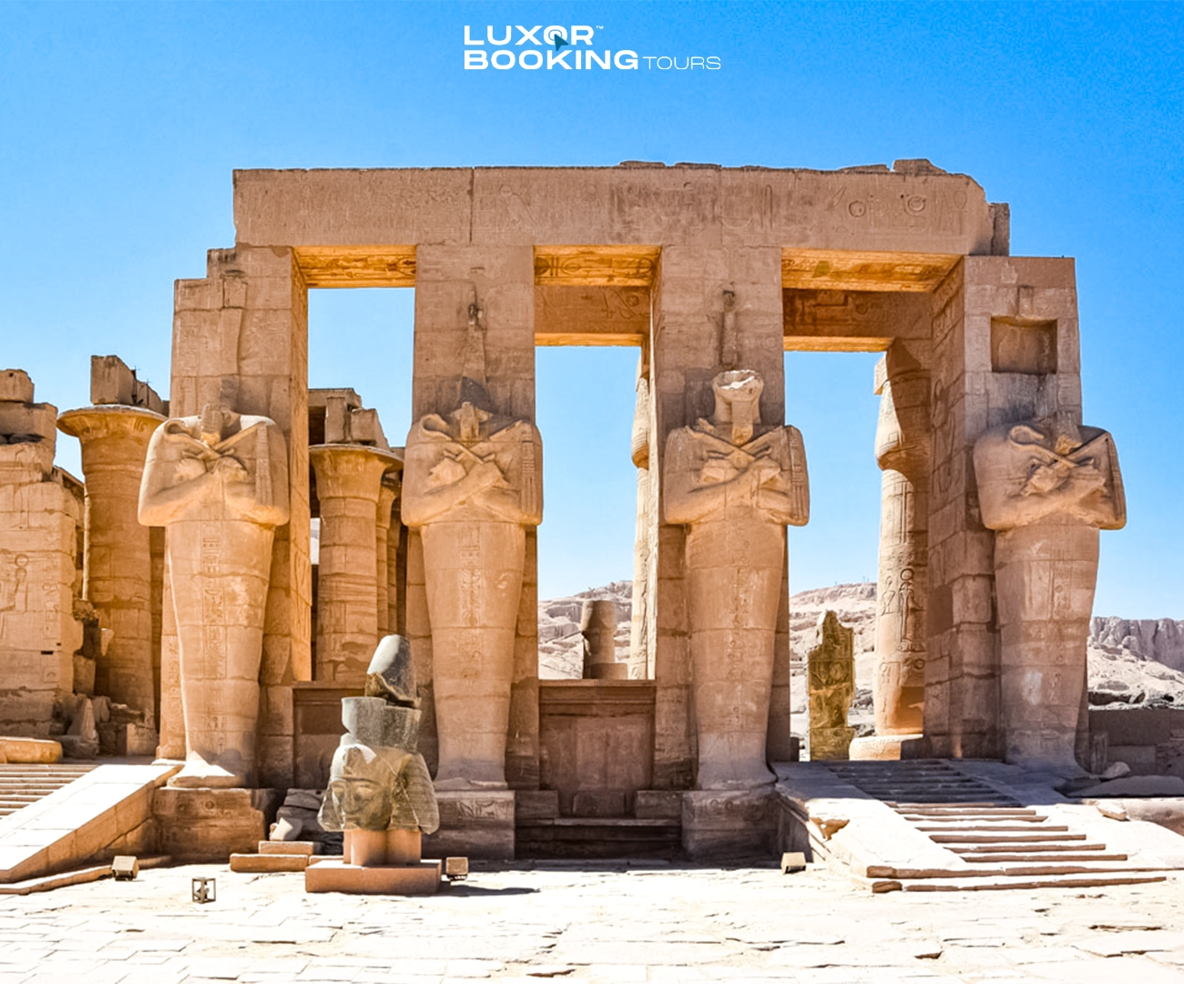 traveler standing inside large luxor temple space looking up