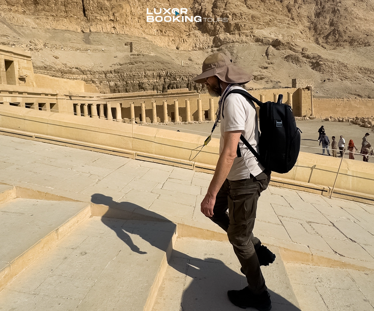 traveler sitting tired near ancient temple after busy luxor itinerary