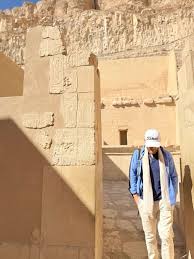 traveler sitting tired near ancient temple after busy luxor itinerary