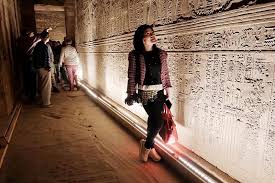 tired traveler sitting after rushing through luxor temples