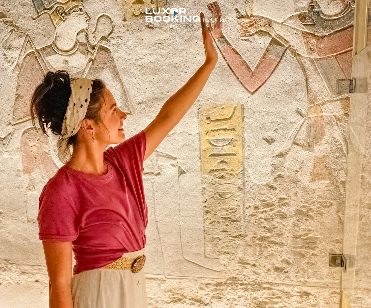 traveler standing quietly inside ancient egyptian temple in reflective mood